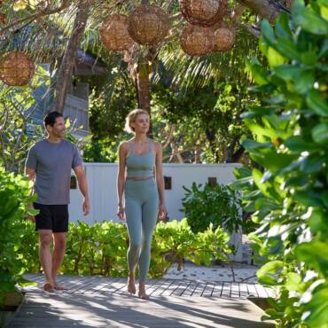 NH_Maldives_Kuda_Rah_Resort_Yoga_Couple_Walk