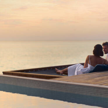 anantara_veli_maldives_resort_property_amenity_couple_pier_sunset_1920x1037