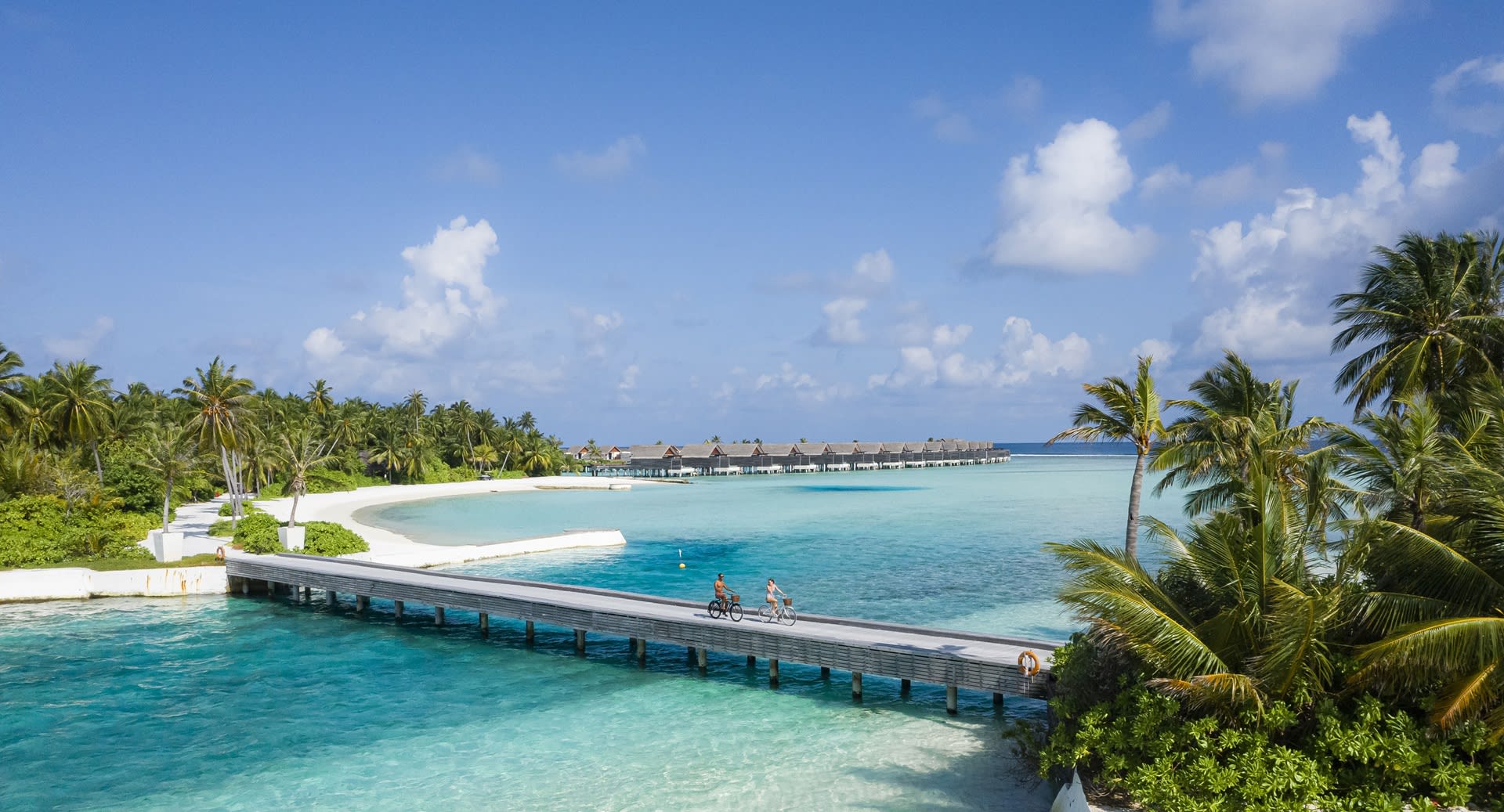 niyama-private-islands---bridge-with-couple-cycling
