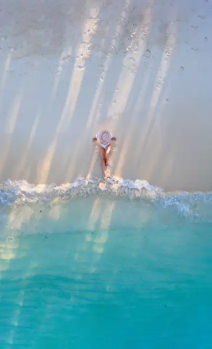 Birds-eye-viewdrone-of-girl-sitting-on-the-beach-in-the-Maldives-with-blue-water-608×1024 Birds-eye-viewdrone-of-girl-sitting-on-the-beach-in-the-Maldives-with-blue-water-608x1024