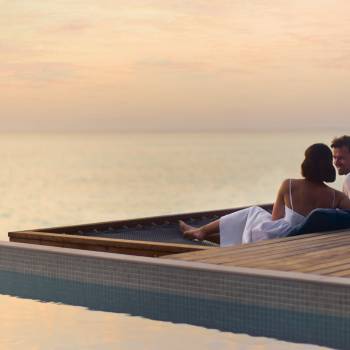 anantara_veli_maldives_resort_property_amenity_couple_pier_sunset_1920x1037
